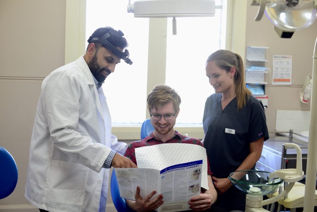 Dr Krishnan assisting patient
